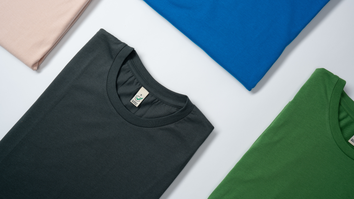 Folded organic cotton clothing from Earth Positive