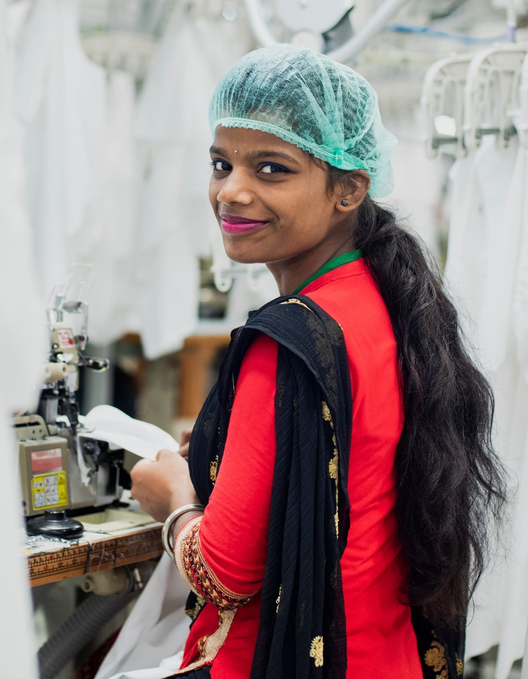 Worker in Fair Wear Foundation monitored clothing production facility